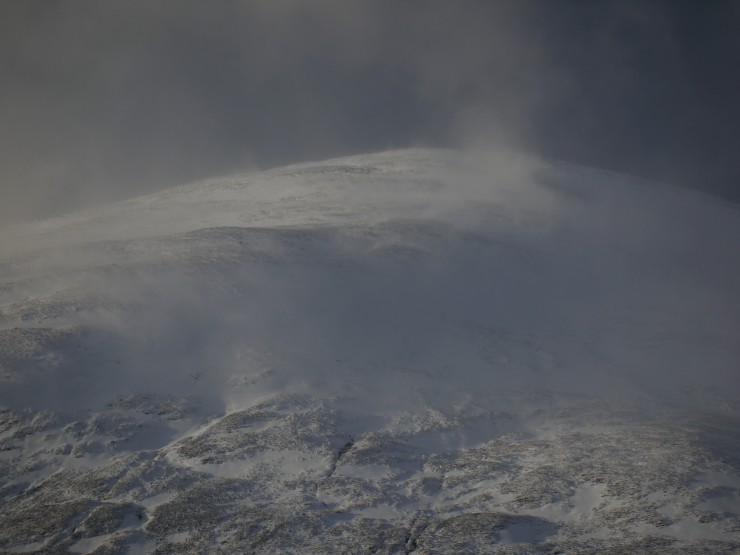 Snow blowing around on Sron a Ghoire. Better visibility between frequent showers.